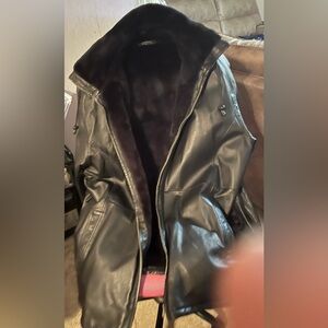 Black leather women’s jacket. Fur on the inside. Size is a women’s 3X